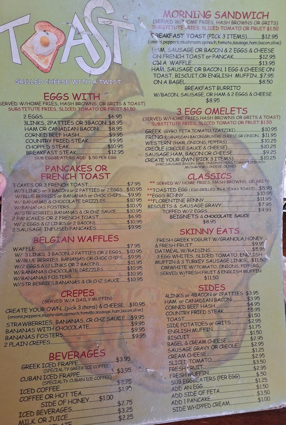 Printed breakfast menu with eggs and omelets.